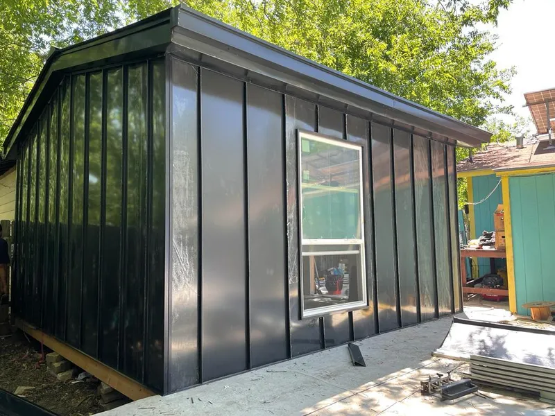 Black standing seam metal wall panels for Roof Inspection in Offutt AFB